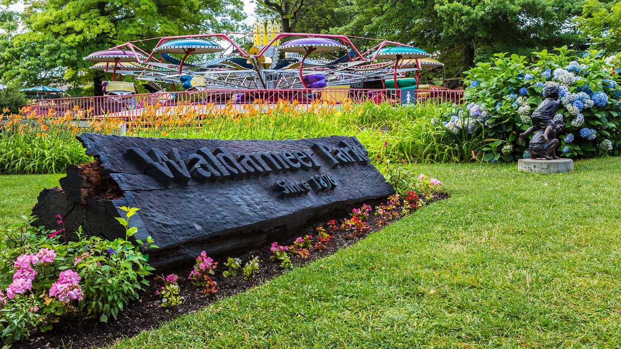 A sign on the lawn that says Waldameer