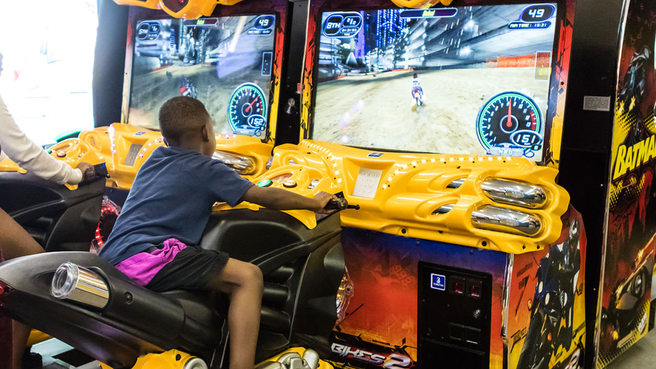 A child plays a motorcycle racing game