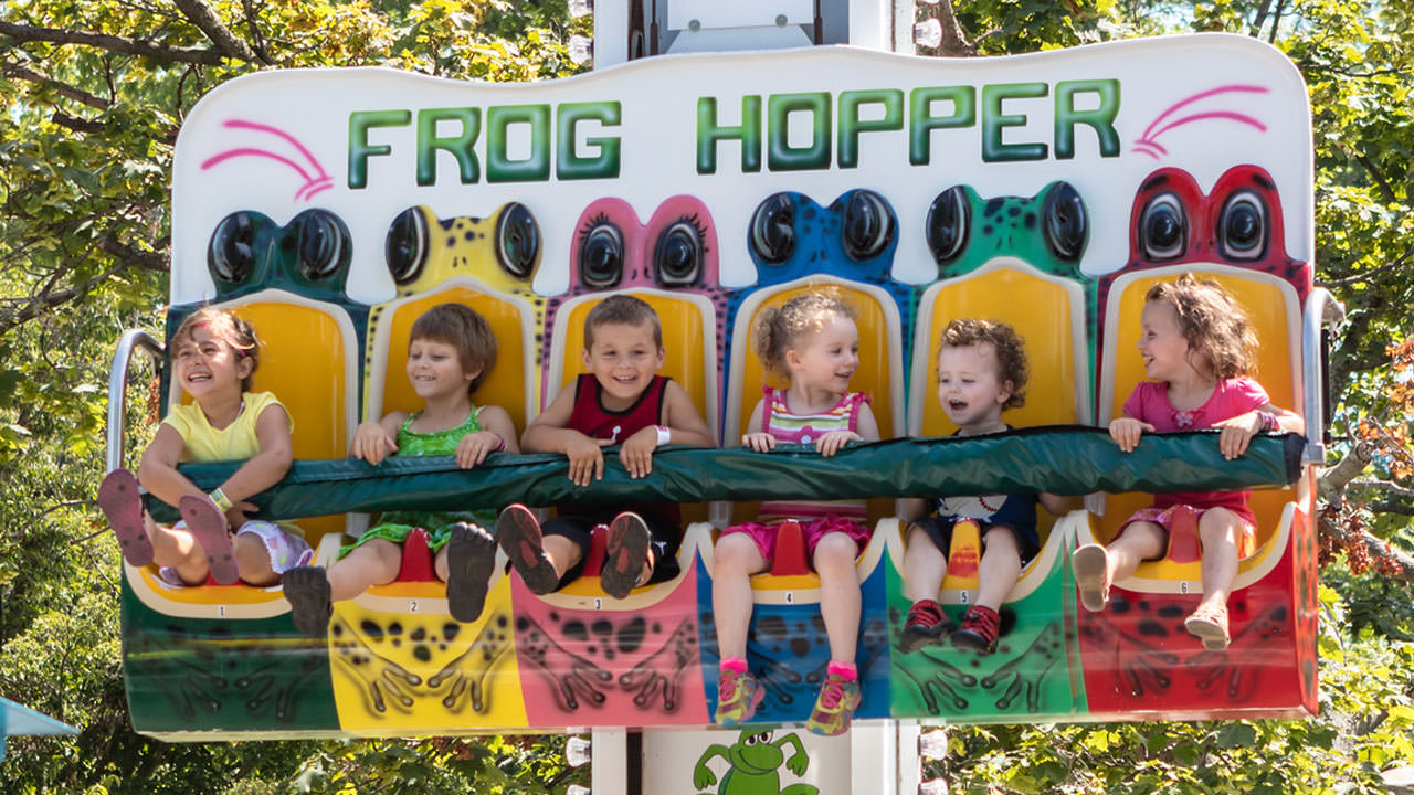 Guests riding the Frog Hopper