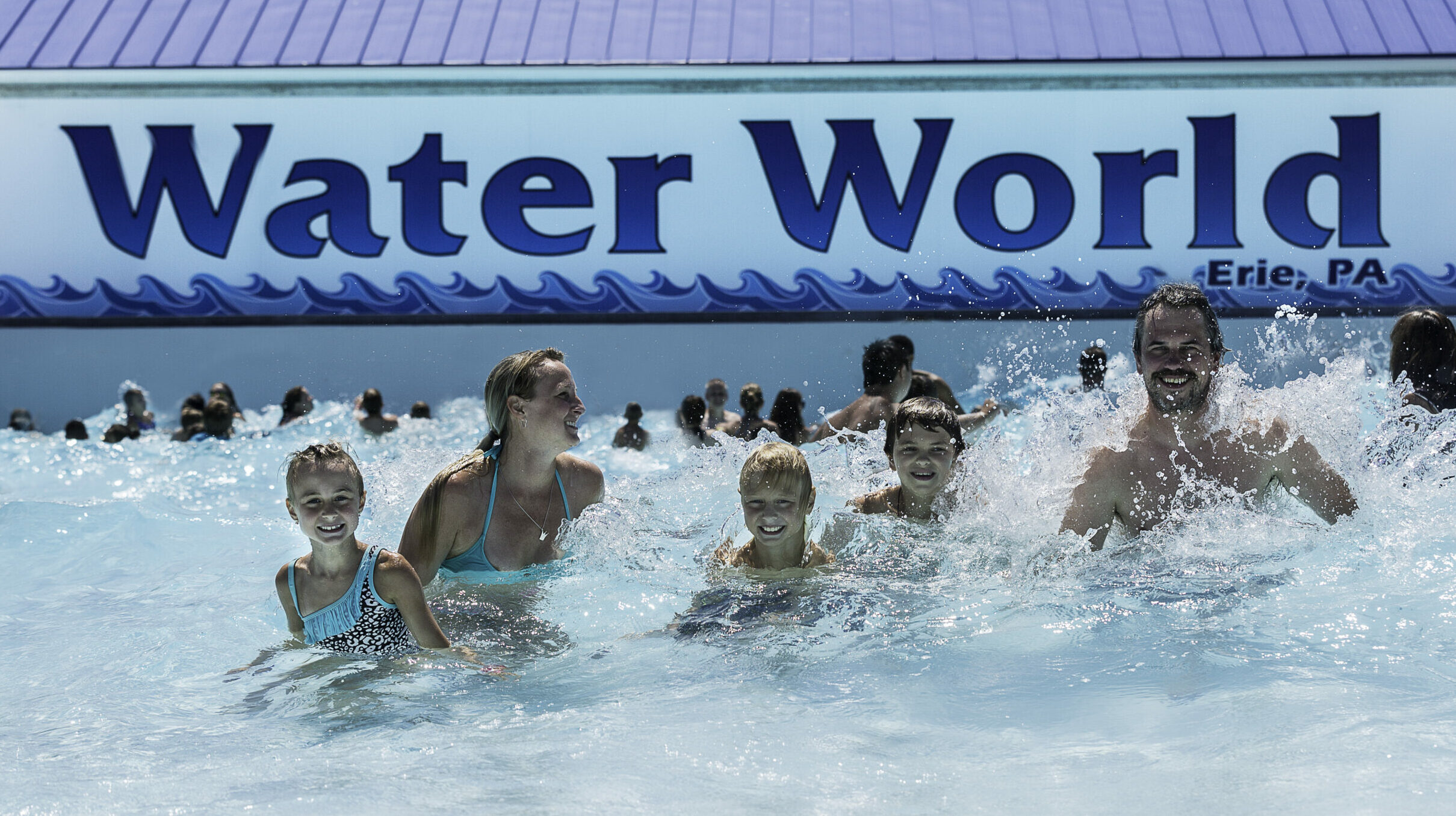 A family enjoying the Wave Pool in Water World.