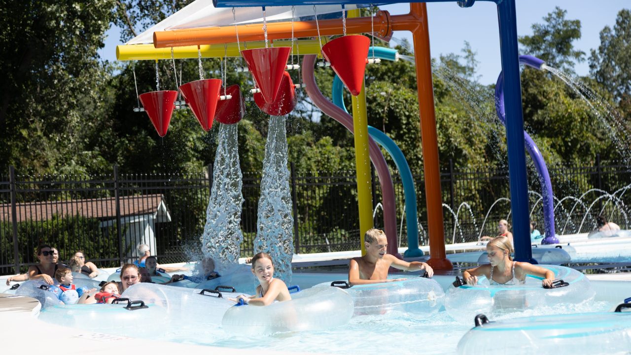 Guests in the Winding Waters endless river in Water World.